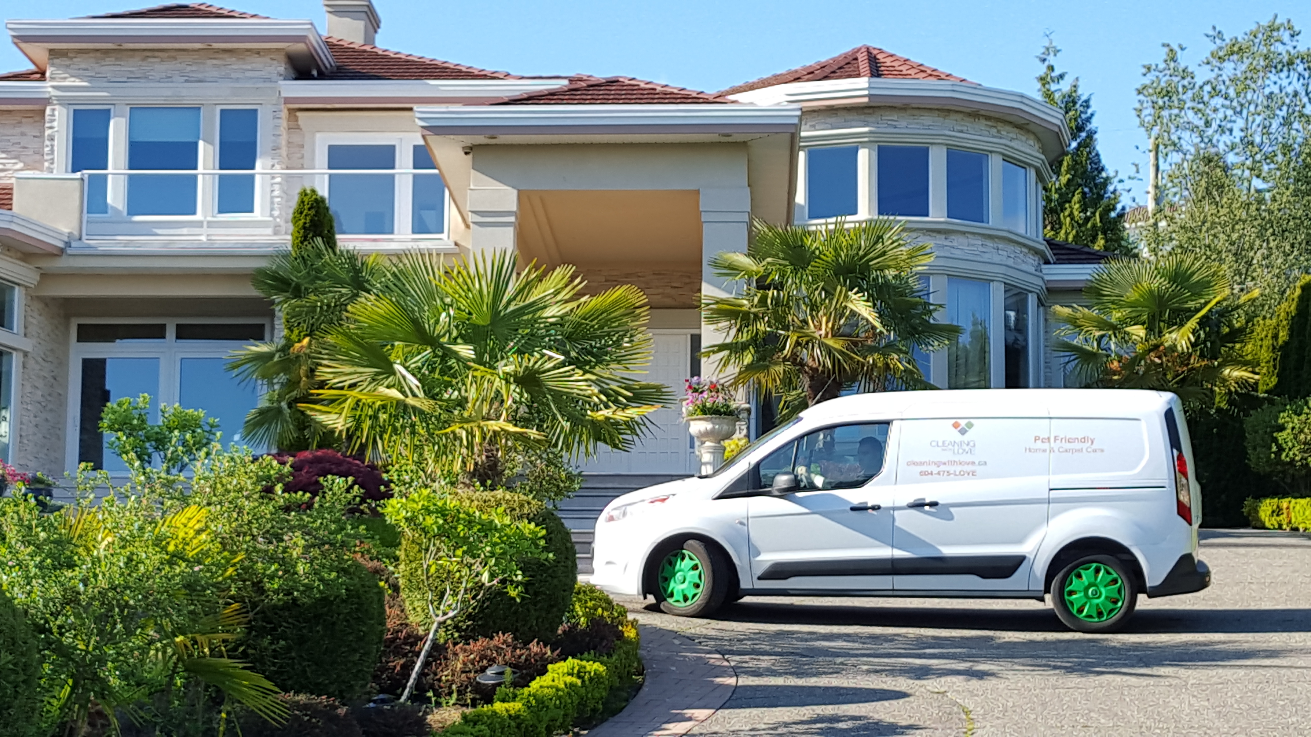 Cleaning with Love van outside West Vancouver home